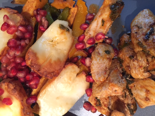 Pomegranate and Lemon Chicken with roasted vegetables and halloumi